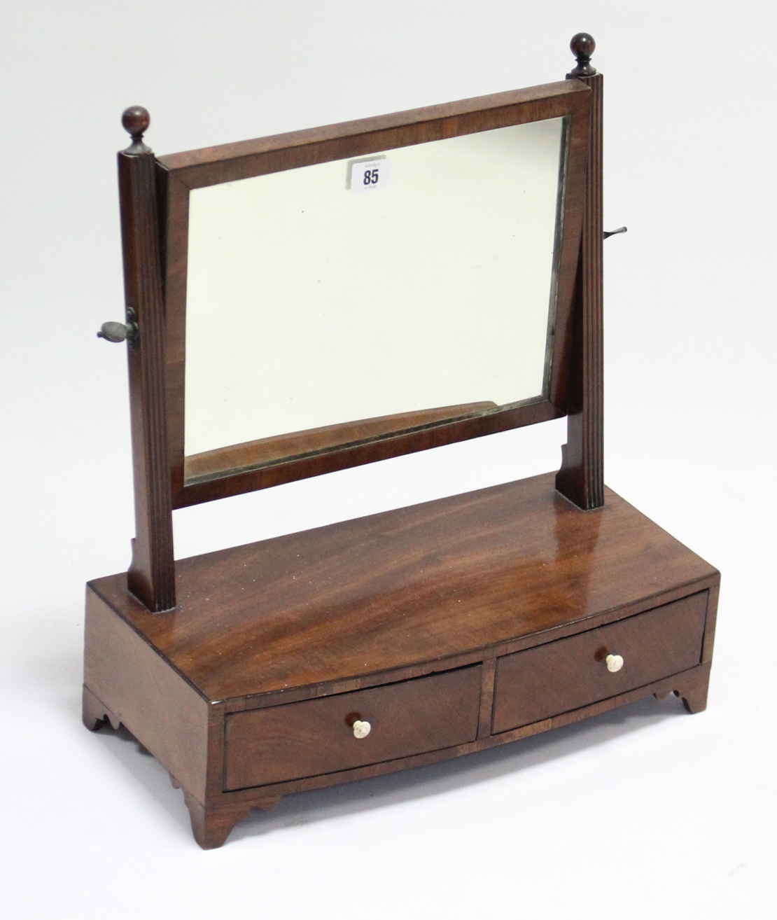 A late 19th/early 20th century mahogany rectangular swing toilet glass fitted two small drawers to