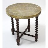 A brass tray-top occasional table on oak base with barley-twist legs, 23½” diam.