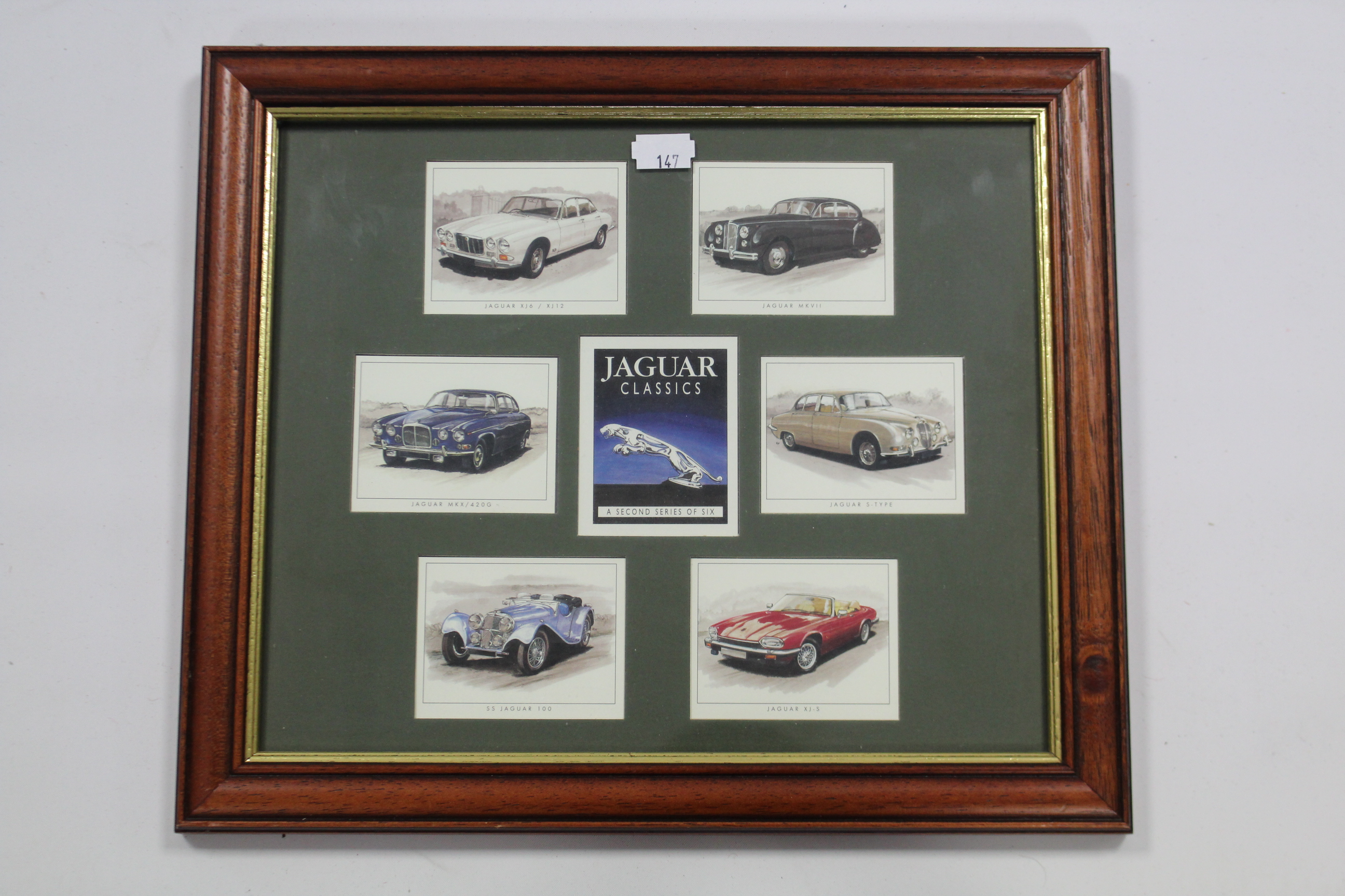 A framed display of various car emblems & badges including Porsche, Jaguar, Lancia, etc. together - Image 2 of 3