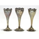 A pair of George V silver spill vases with rims & round domed feet, 6½” high, London 1910 by Jackson