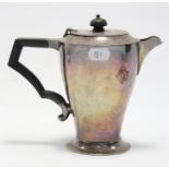 A silver round tapered hot-water jug with ebonised angular handle, 6½” high; London 1934 b Josiah