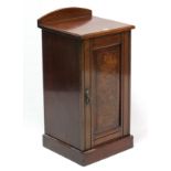 A Victorian walnut pot cupboard enclosed by panel door, & on plinth base, 15¼” wide.