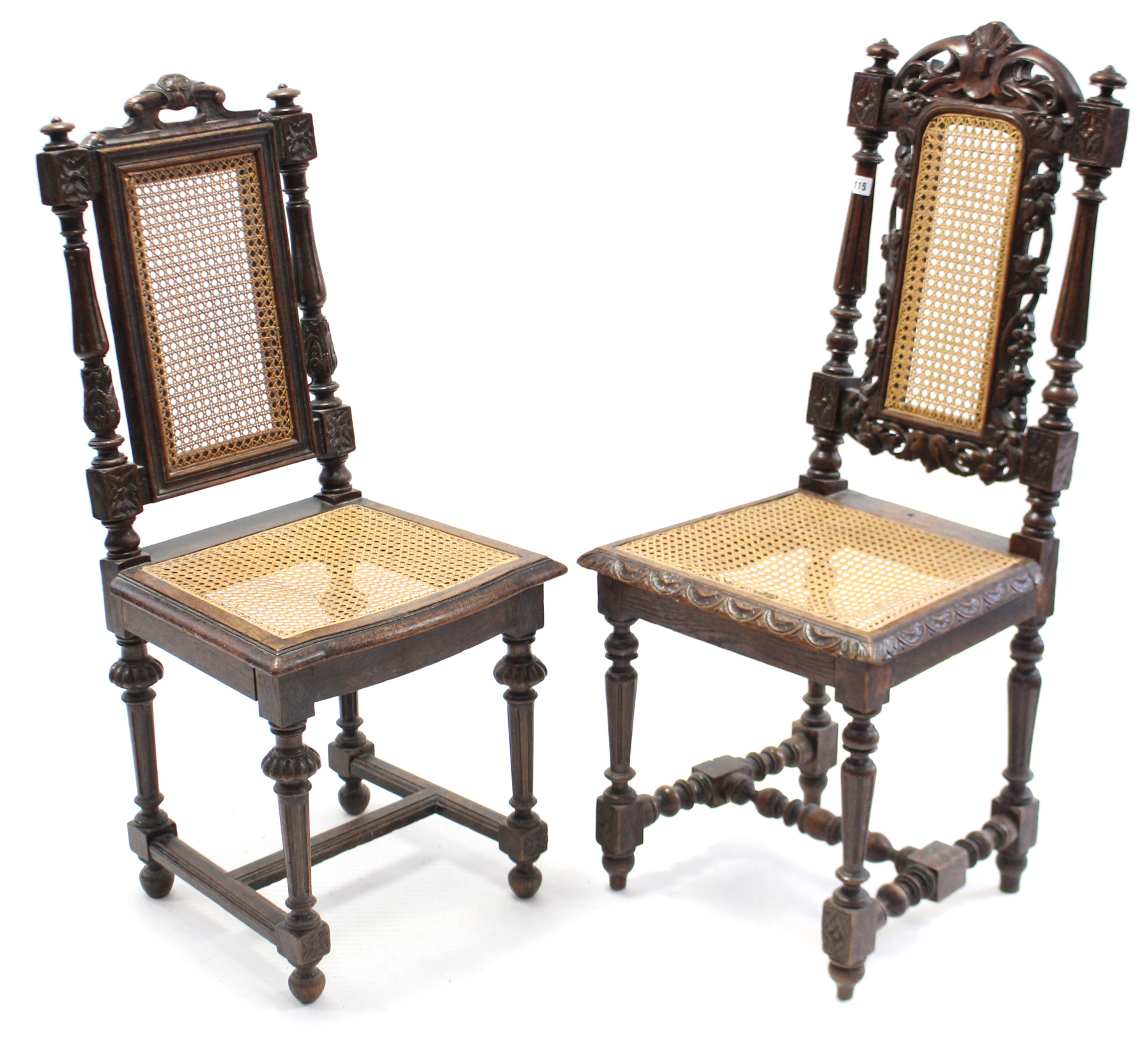 A pair of Carolean-style carved oak hall chairs each with woven can seat & back, & on turned &