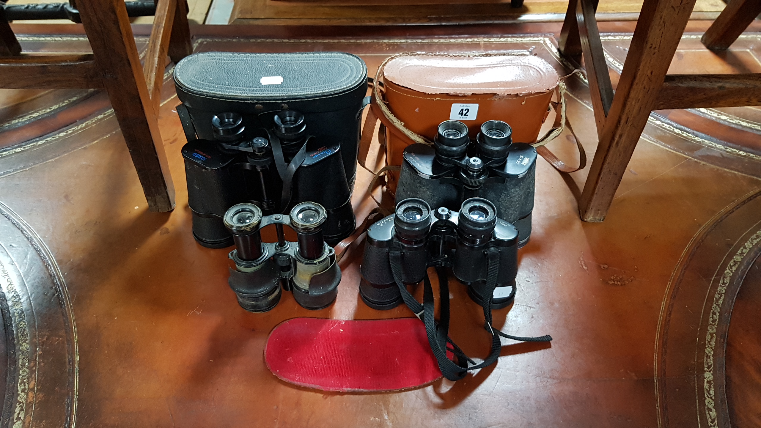 Four pairs of binoculars; two pairs with cases.