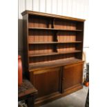A VICTORIAN MAHOGANY TALL BOOKCASE, the upper part fitted four shelves enclosed by pair of glazed