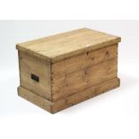 A pine blanket box, with hinged lift-lid, wrought iron side handles, & on plinth base, 32¼” wide x