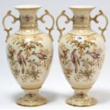 A pair of Crown Ducal ware ovoid two-handled vases of buff ground & with bright-coloured exotic bird