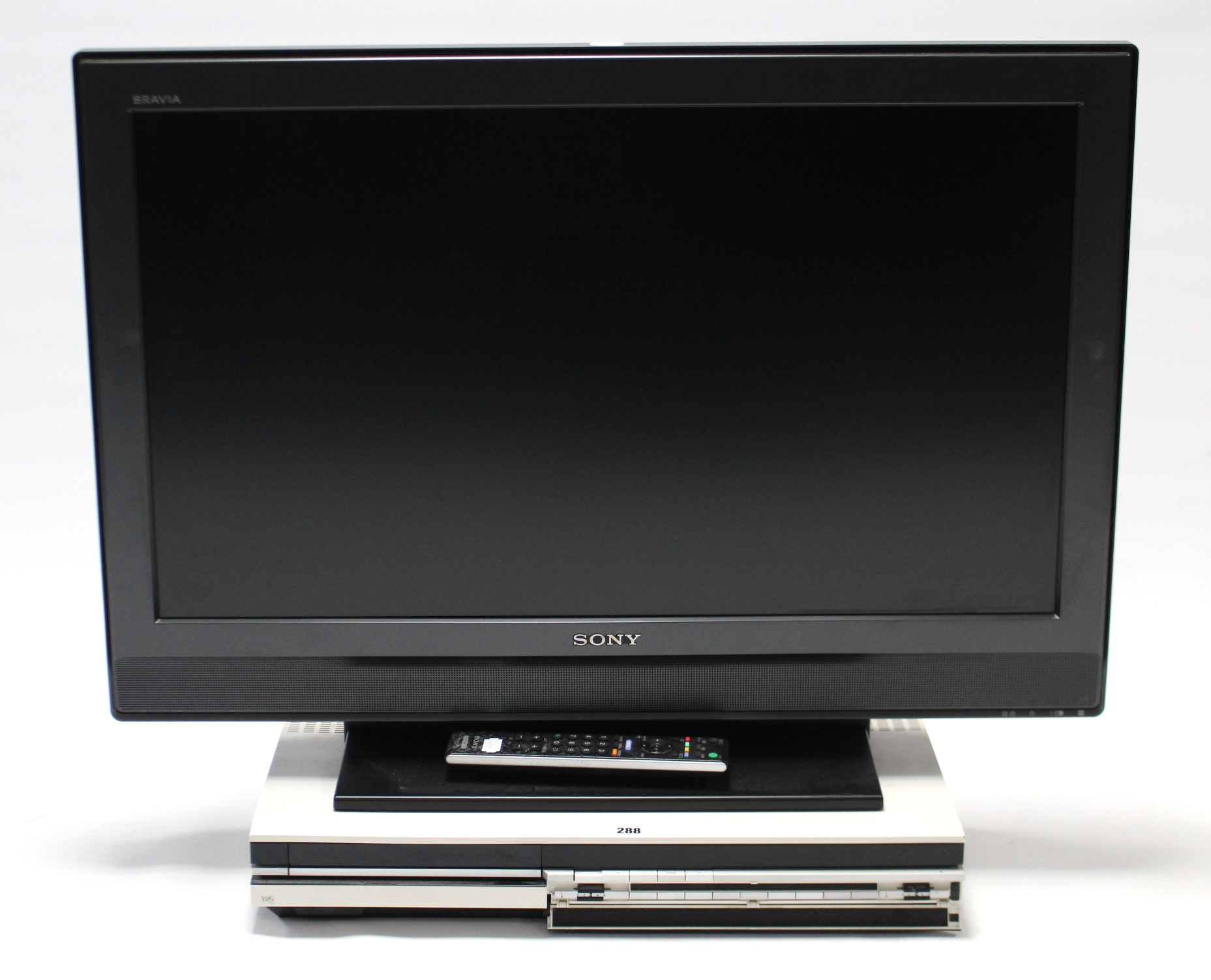 A Bang & Olufsen “VX 5000” VHS tape recorder; & a Sony “Bravia” 31” LCD television with remote