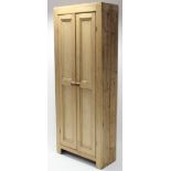 A pine tall hall cupboard fitted three shelves enclosed by pair of panel doors, 29¾” wide x 76”