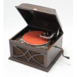 An HMV table-top gramophone in oak case, 17½” wide x 13” high.