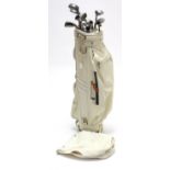 A matched set of thirteen steel-shafted golf clubs, with golf club bag.