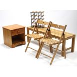 A pine bedside cabinet; together with a teak rectangular coffee table; a pair of fold-away chairs; &