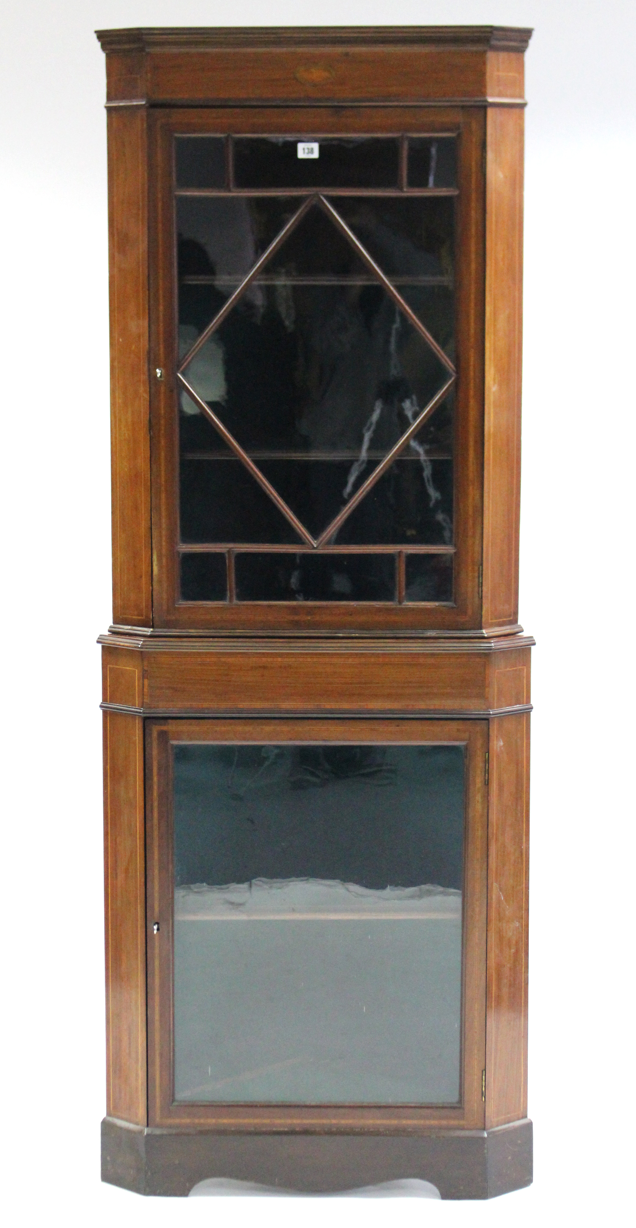 A 19th century inlaid-mahogany tall standing corner cabinet, fitted three shelves enclosed by pair
