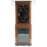 A 19th century inlaid-mahogany tall standing corner cabinet, fitted three shelves enclosed by pair