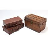 A grained-tin travelling trunk with hinged lift-lid & wrought-iron side handles, 23” wide;
