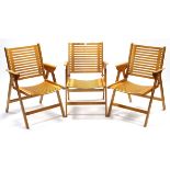 A set of three bentwood folding elbow chairs with slatted wooden seats & backs.