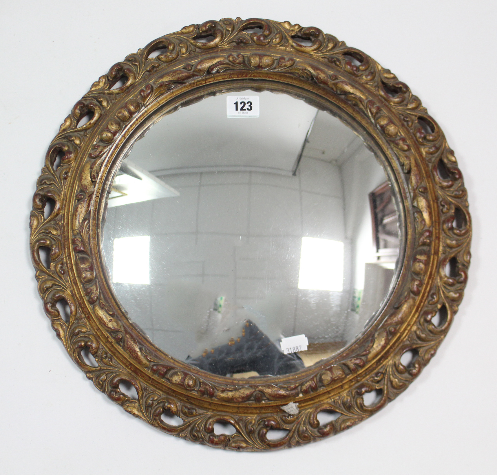 A gilt-frame convex wall mirror, 16” diam.; & various decorative pictures.