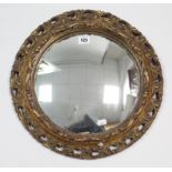 A gilt-frame convex wall mirror, 16” diam.; & various decorative pictures.