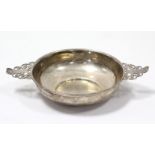 A late Victorian silver Quaich with planished surface & pierced foliate handles, 6¾” wide; London