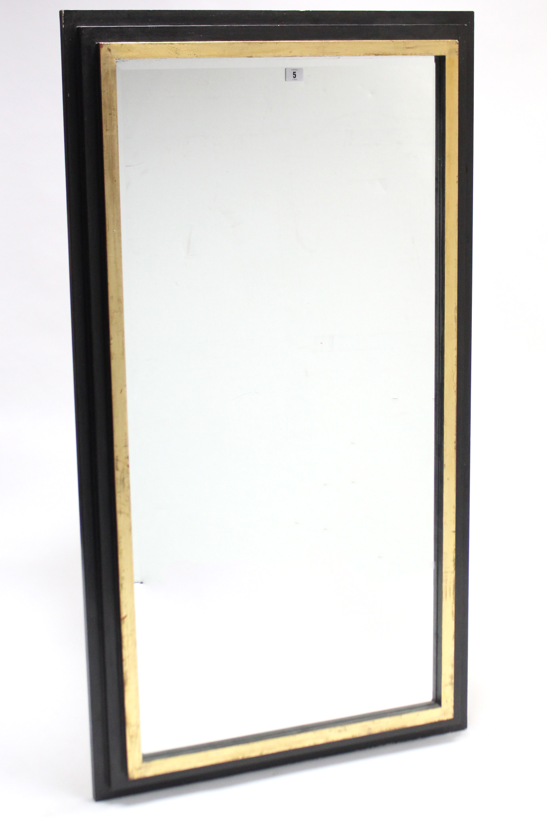 A large rectangular wall mirror in ebonised & gilt frame, & inset bevelled plate, 53¼” x 29”.