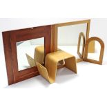 A plywood rectangular occasional table/magazine rack, 27½” wide; together with three wall mirrors.