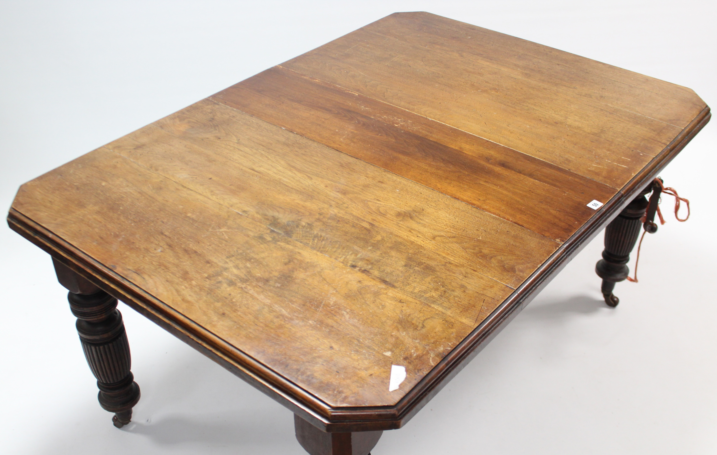 A Victorian walnut extending dining table with canted corners & moulded edge to the rectangular top, - Image 2 of 3