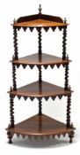 A Victorian mahogany four-tier corner whatnot with spiral-twist supports, & on turned feet, 19” wide