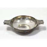 A George V silver Quaich with pierced scroll flat handles, 7” wide; London 1910, by Jackson &