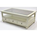 A white painted wooden large rectangular two-tier coffee table inset bevelled tempered-glass top,