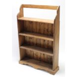 A pine standing four-tier open bookcase, 31½” wide x 49” high.