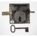 An antique iron door lock, 7½” square, with key; & a pair of wooden door/window frame panels, 37¼” x