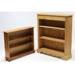 A pine standing open bookcase, fitted two shelves & on shaped plinth base, 37½” wide x 43” high; & a