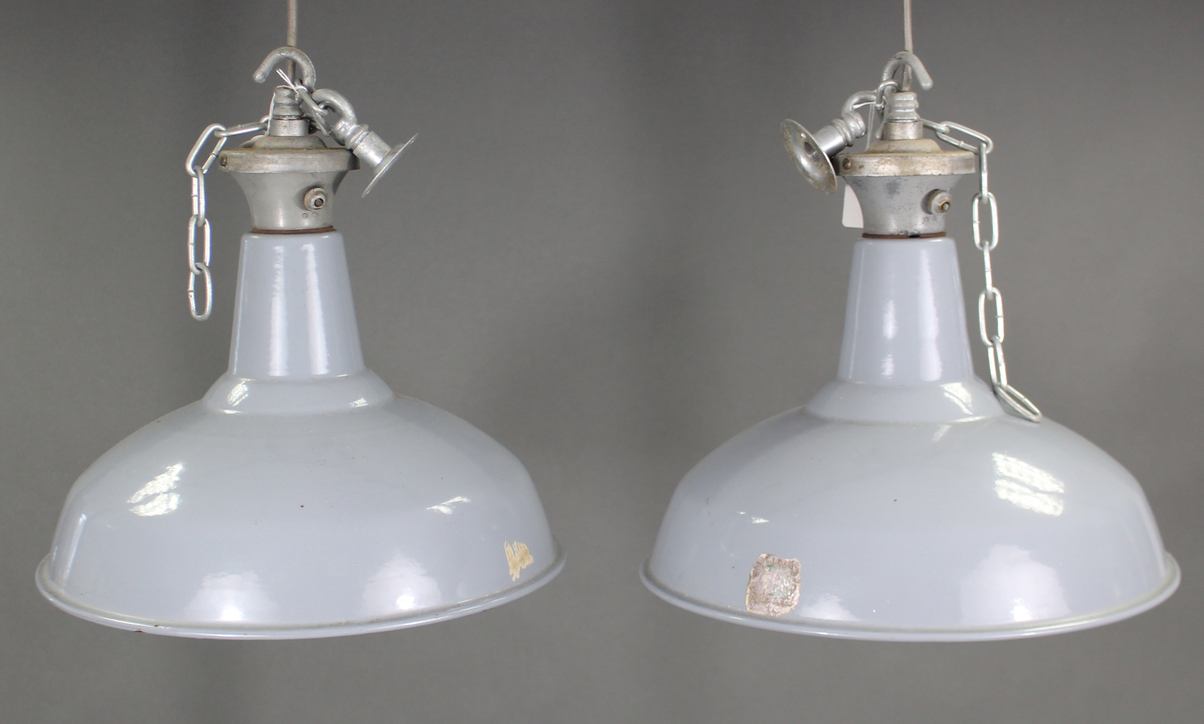 A pair of mid-20th century Benjamin industrial pendant ceiling lights with blue/grey enamel
