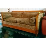 A Victorian-style mahogany-finish frame three-seater settee with loose cushions to the seat & back
