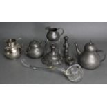 A pewter three-piece tea service; a pewter candlestick (w.a.f.); a silver-plated “Guernsey” milk