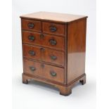 A reproduction television cabinet in the form of an 18th century style chest, the two short & two