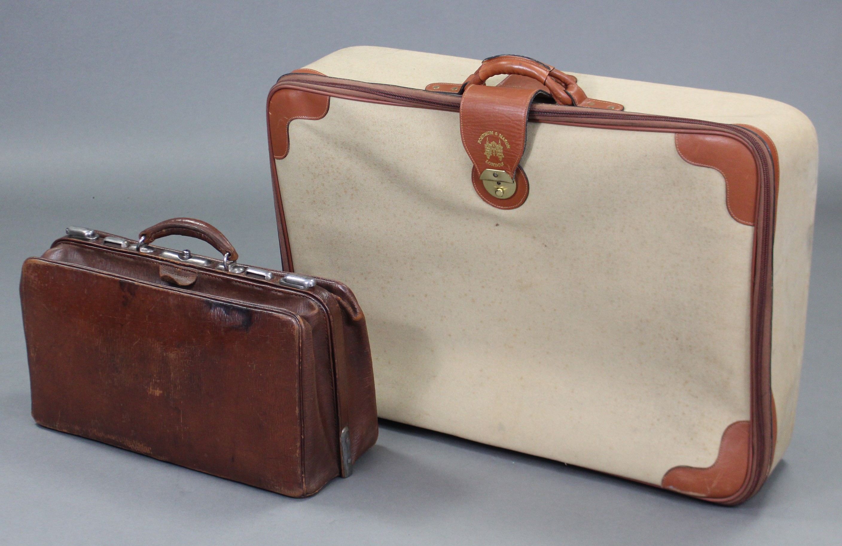 A Fortnum & Mason brown leather & khaki canvas large suitcase; & a brown leather Gladstone-type