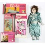 Four Sindy doll accessories “Bed & Bedclothes”; Dressing Table & Stool”; “Hairdryer”; & “