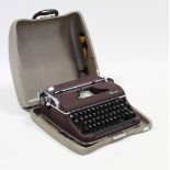 An Olympic portable typewriter, with case.