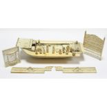 A 19th century finely carved & pierced ivory model of a house-boat, approximately 12” long –