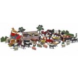 Various painted lead farm animal models, model carts, fences, etc.