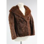 A Herman Furs of Toronto silk-lined rabbit fur ladies’ coat; two fur stoles; & a ladies’ fur hat.
