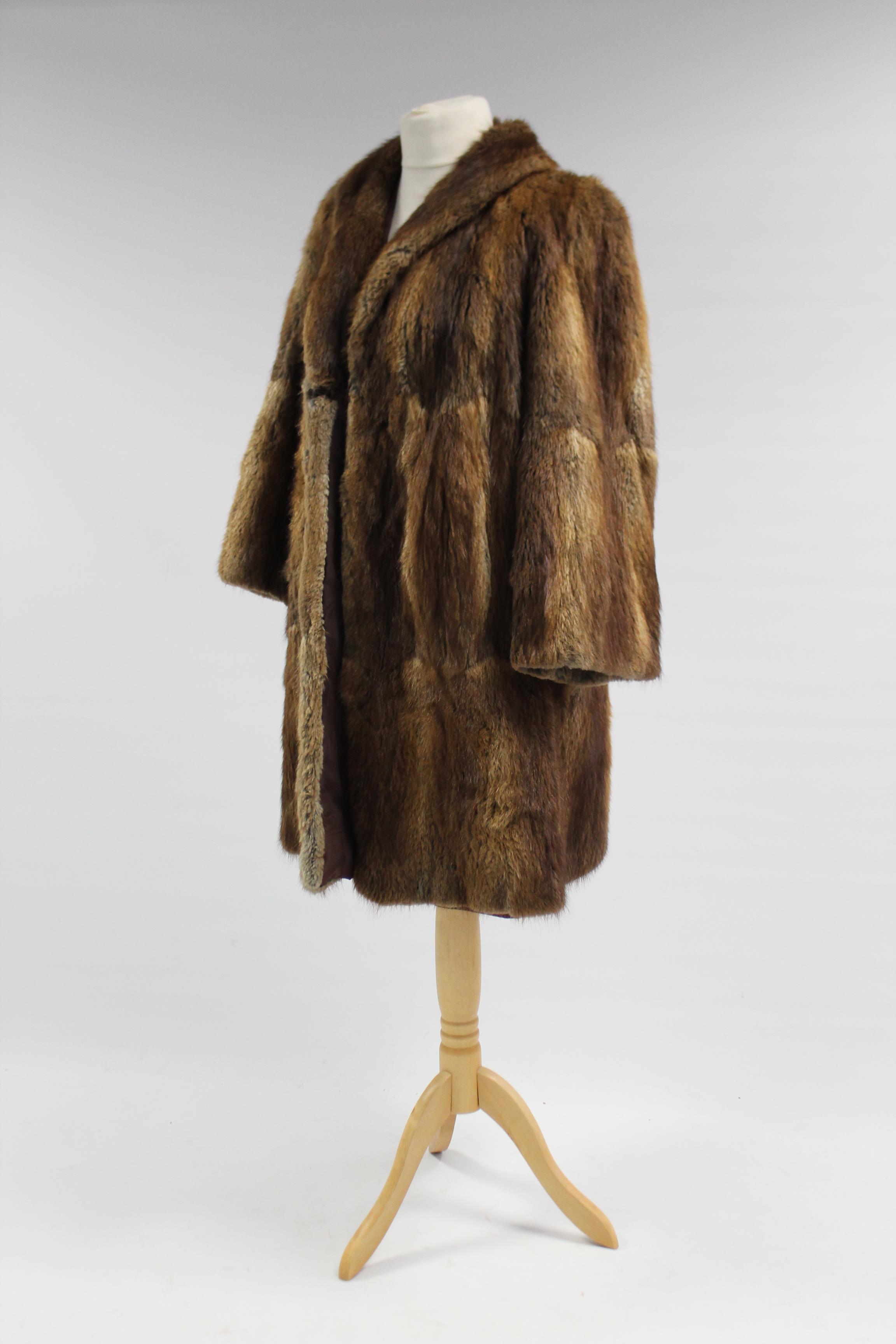 A rabbit fur silk-lined ladies’ coat; & a similar silk-lined fur cape.
