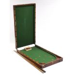 A late 19th/early 20th century mahogany folding bagatelle board by A. W. Gamage Ltd. of Holborn,