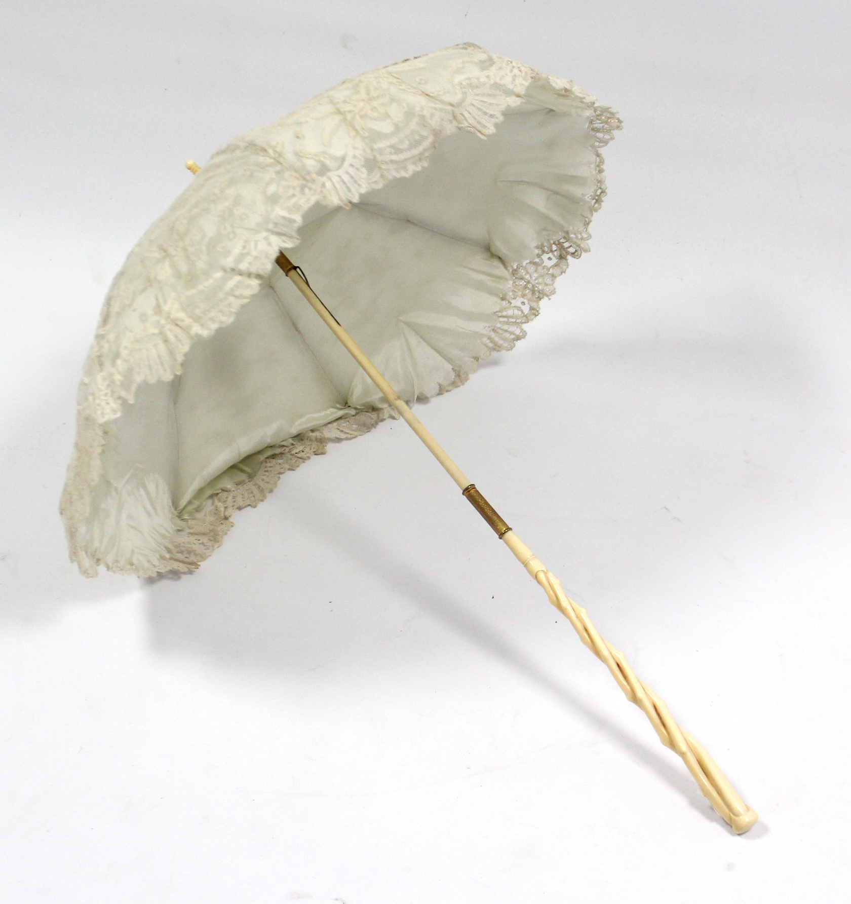 An early 20th century lace ladies’ parasol with folding ivory handle; together with an ivory fan; - Image 2 of 2