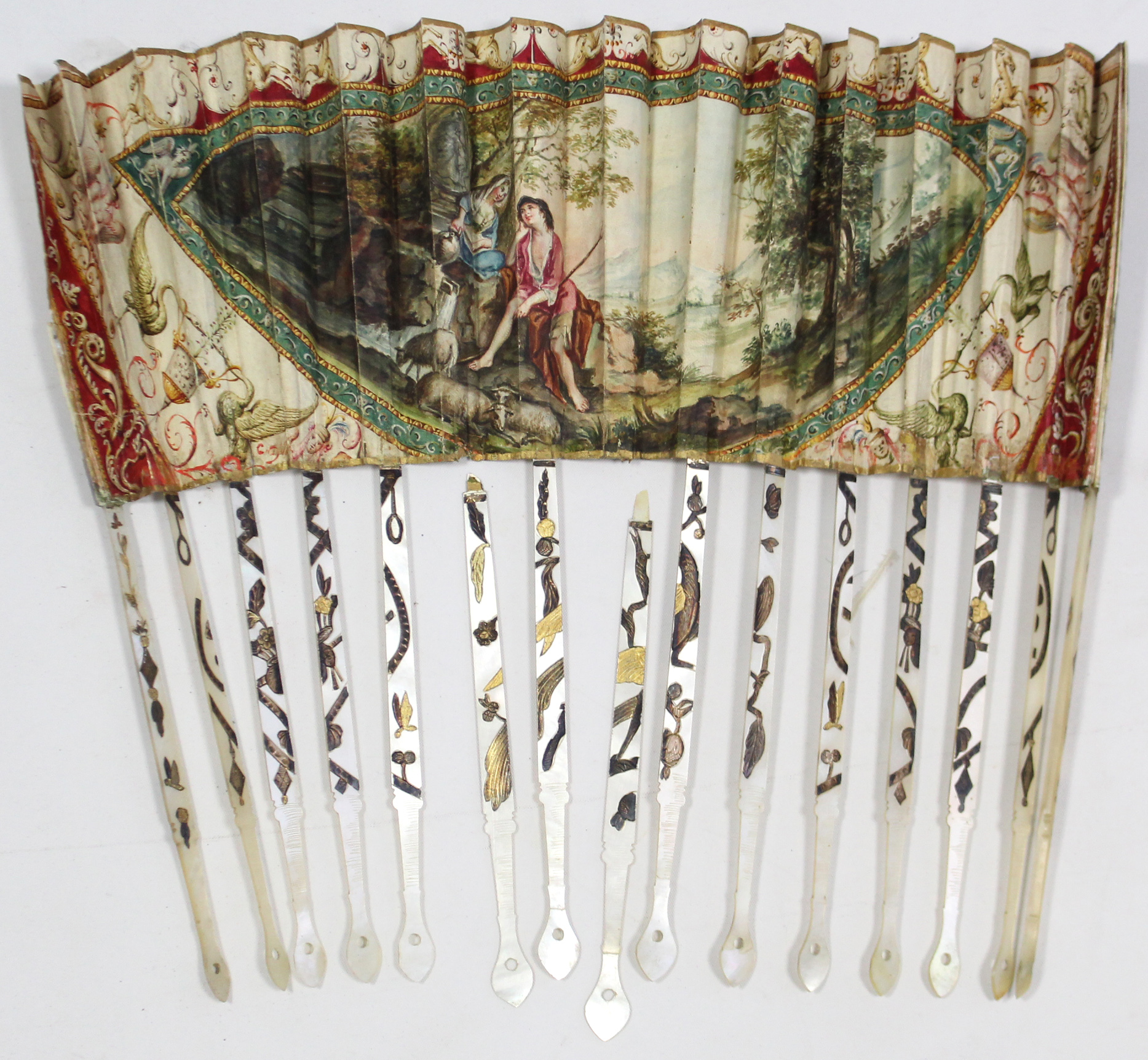 A 19th century fan, the vellum leaf with painted romantic scene decoration, & with mother-of-pearl