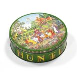 A HUNTLEY AND PALMERS KATE GREENAWAY RISQUÉ BISCUIT TIN, 8” diam.