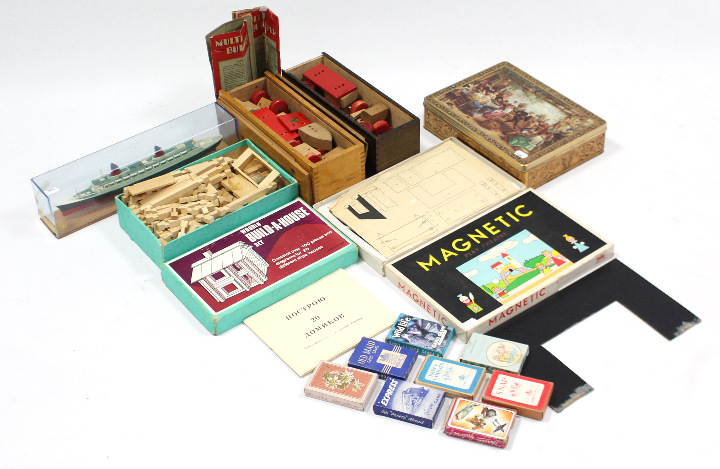 A Russian wooden “Build-A-House” set, boxed; two Multi-Builder wooden construction sets; a model