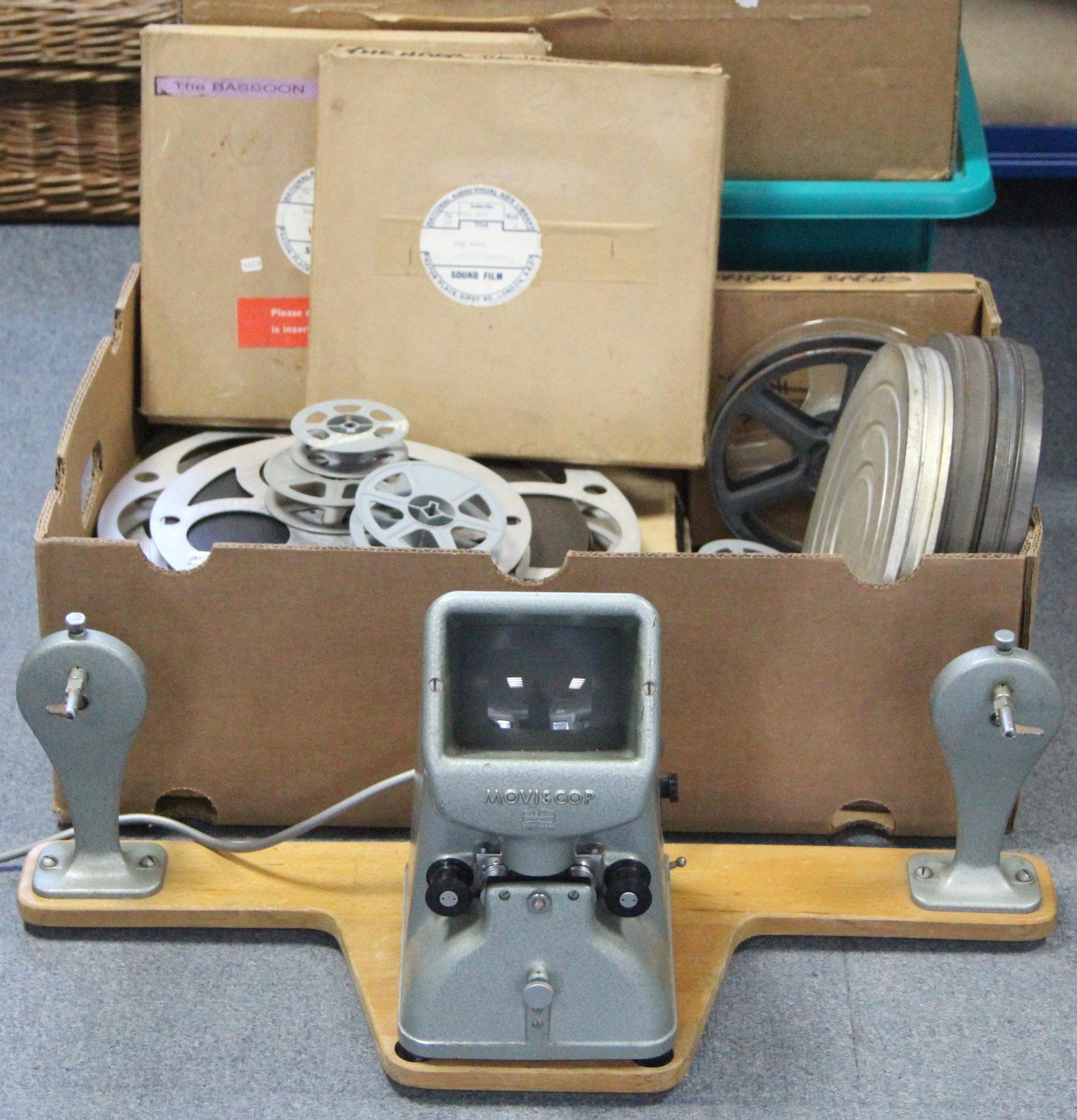 A collection of 16mm film reels; a film projector; & a film editor. - Image 4 of 11