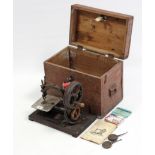 An early 20th century Willcox & Gibbs hand sewing machine, in deal case.